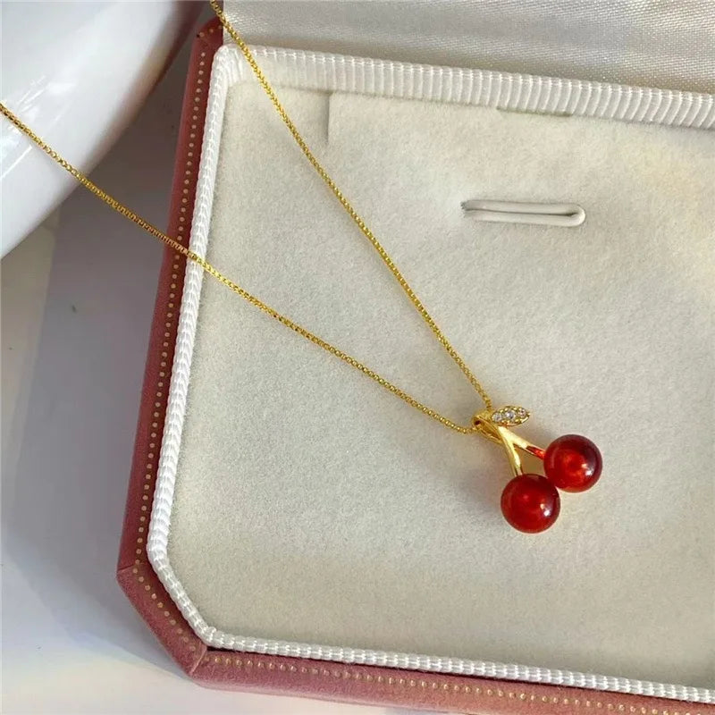 The 2025 summer classic sweet wine red cherry pendant necklace is a fashionable and individual fruit golden chain necklace for w